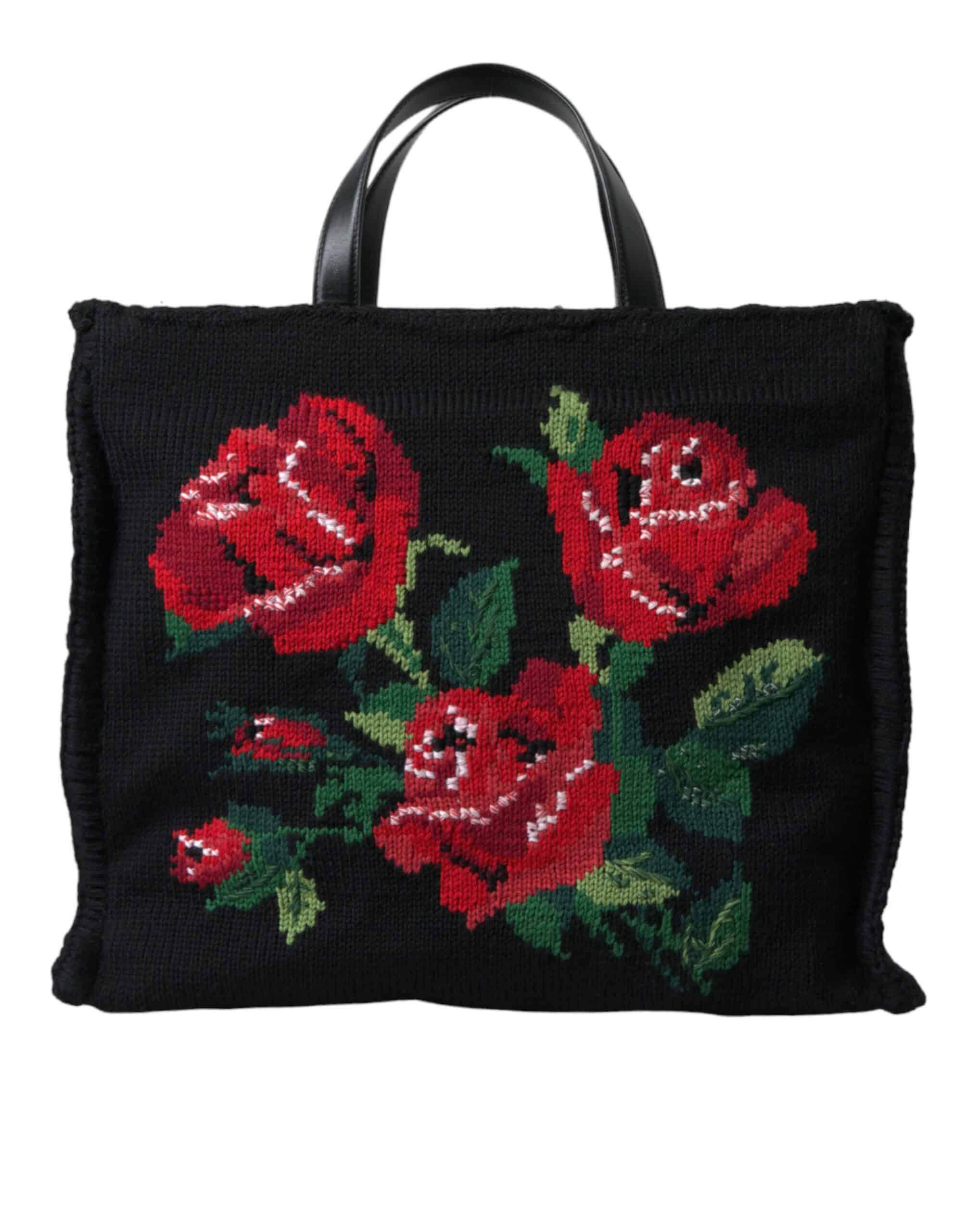 Sac noir avec des roses rouges brodées.