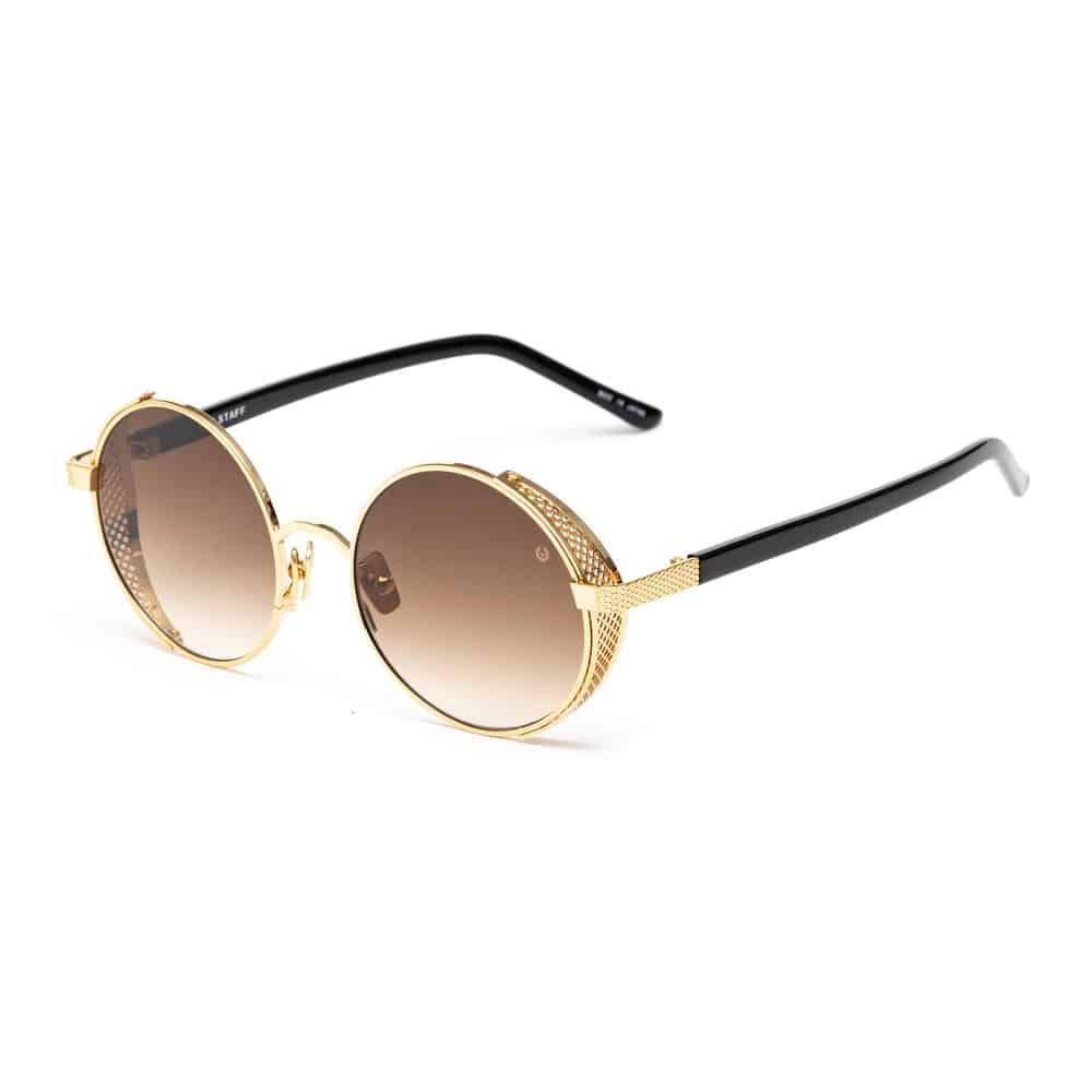 Lunettes de soleil rondes avec monture dorée.
