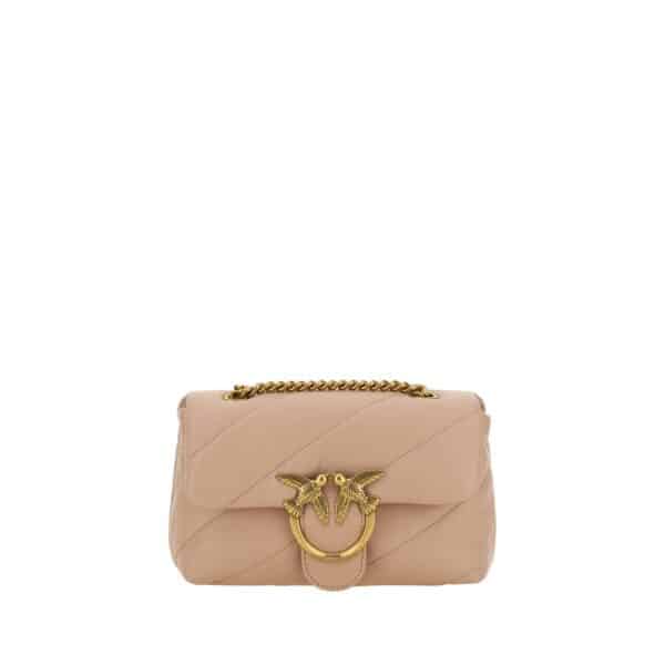 Sac à main en cuir rose avec embellissement doré